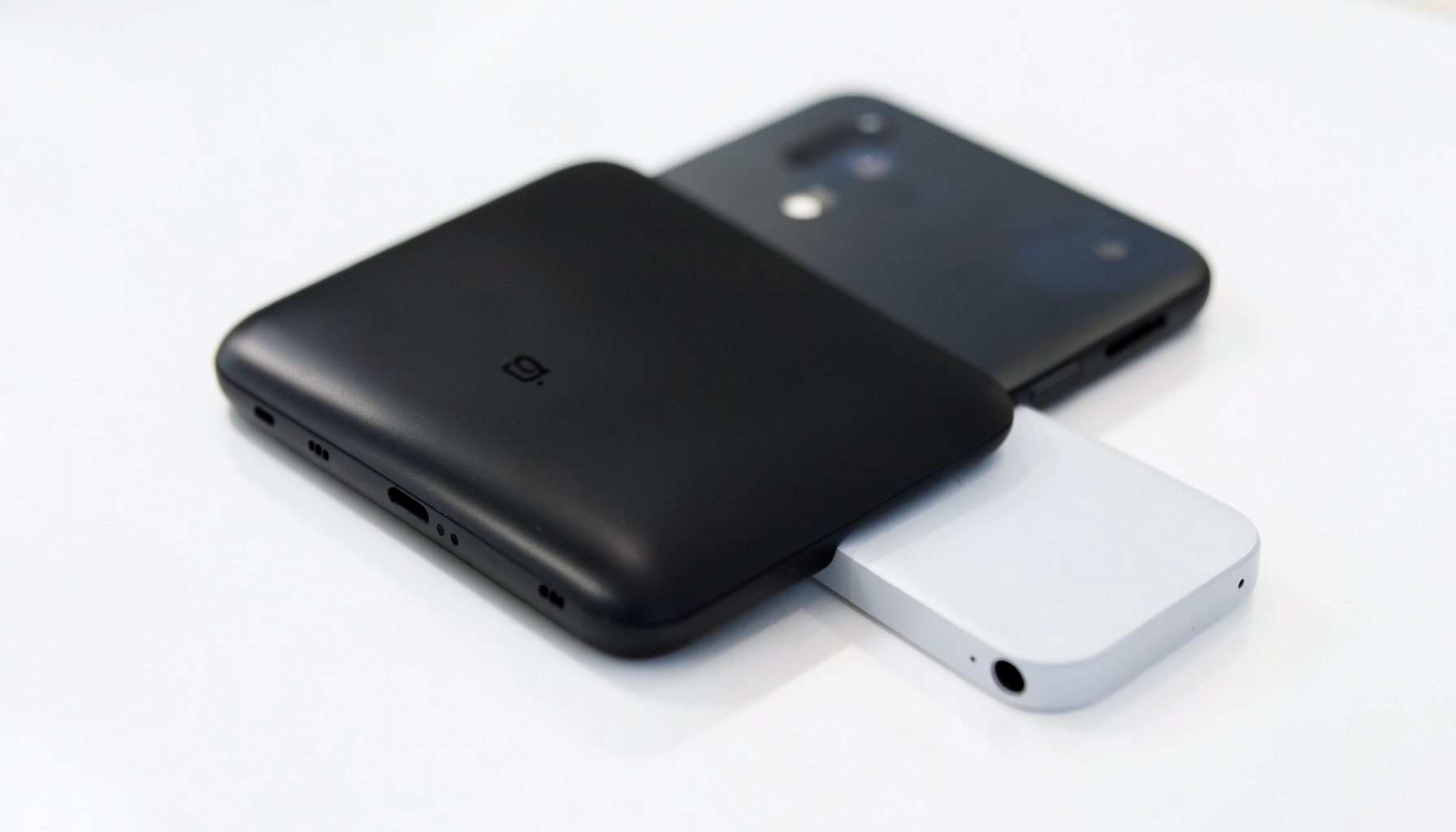 OnePlus 5 smartphone on a bright surface, sleek dark device